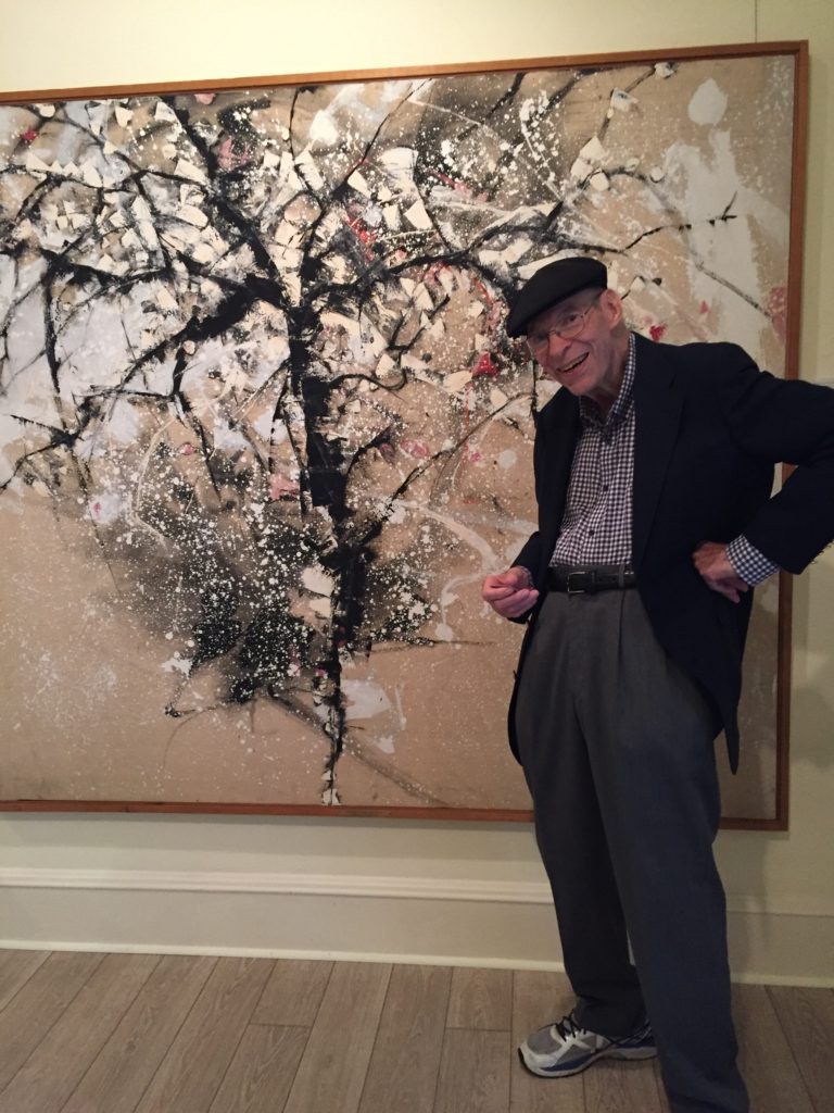 Art Professor Bill Bristow with his 1961 painting, Cherry Tree in Snow, 
